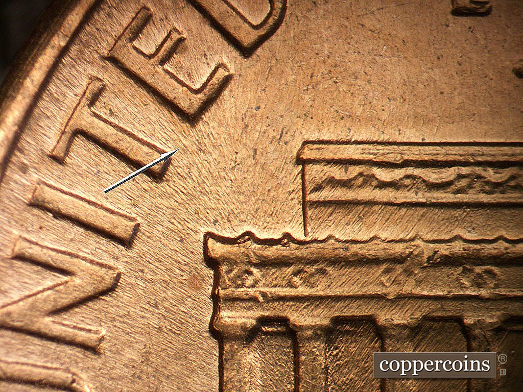 Die-stage A marker on 1968S•1DO•011 showing NW die flow line between TE in UNITED.