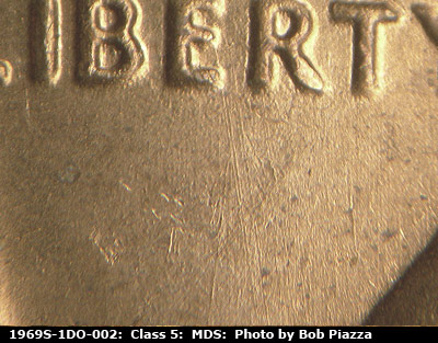 Die-stage B marker on 1969S•1DO•002 (1969 Doubled Die Obverse).