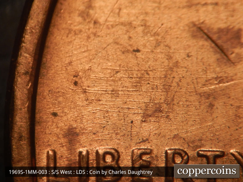 Die-stage C marker on 1969S•1MM•003 (1969 Repunched Mint Mark).