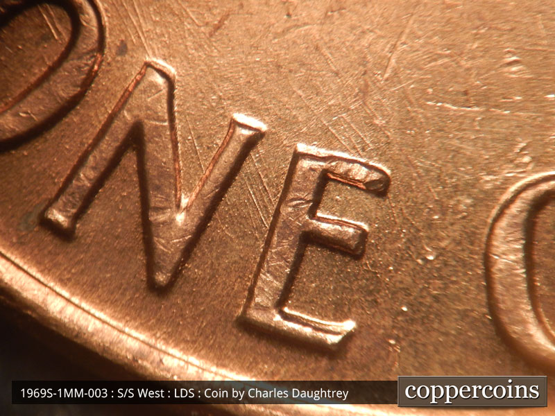 Die-stage C marker on 1969S•1MM•003 (1969 Repunched Mint Mark).