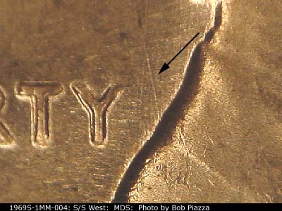 Die-stage B marker on 1969S•1MM•004 (1969 Repunched Mint Mark).