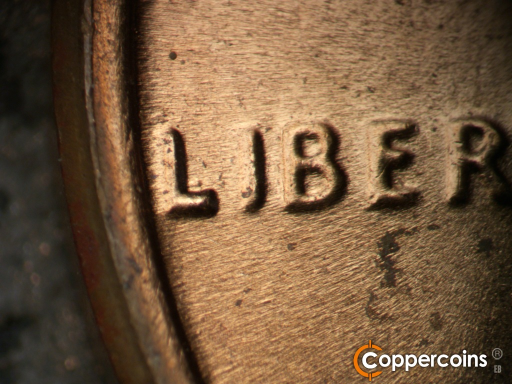 Die-stage C marker on 1970D•1DO•015 showing Closeup of extra horizontal bar in L of LIBERTY.
