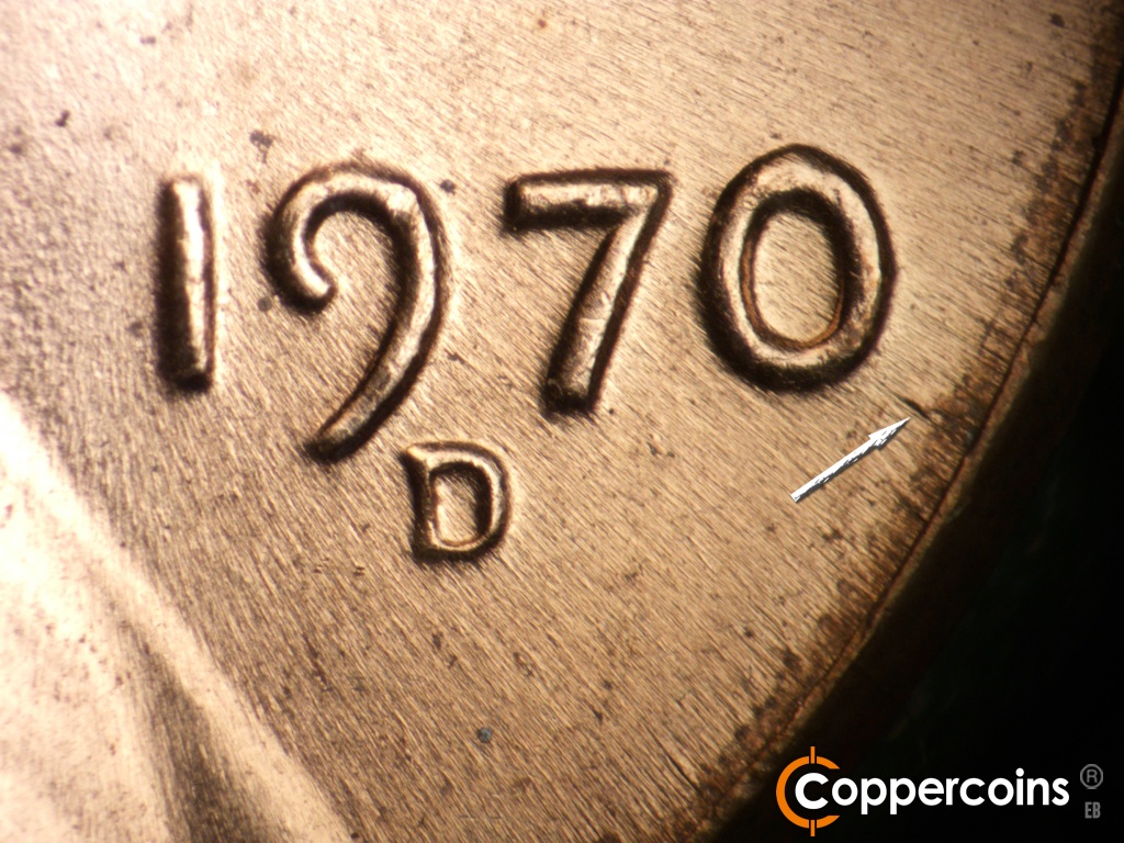 Die-stage C marker on 1970D•1DO•015 showing Die gouge between rim and bottom of 0 in date.
