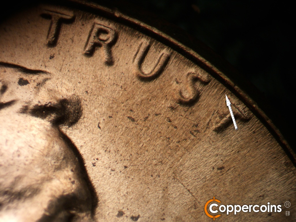 Die-stage C marker on 1970D•1DO•015 showing Die flow line between ST in TRUST.