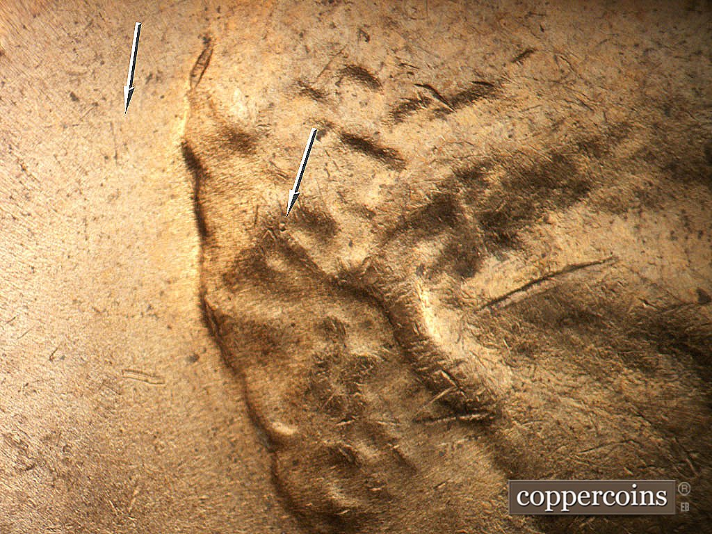 Die-stage B marker on 1971D•1MM•020 showing Weak E/W die scrartch behind head, Die dot in hair.