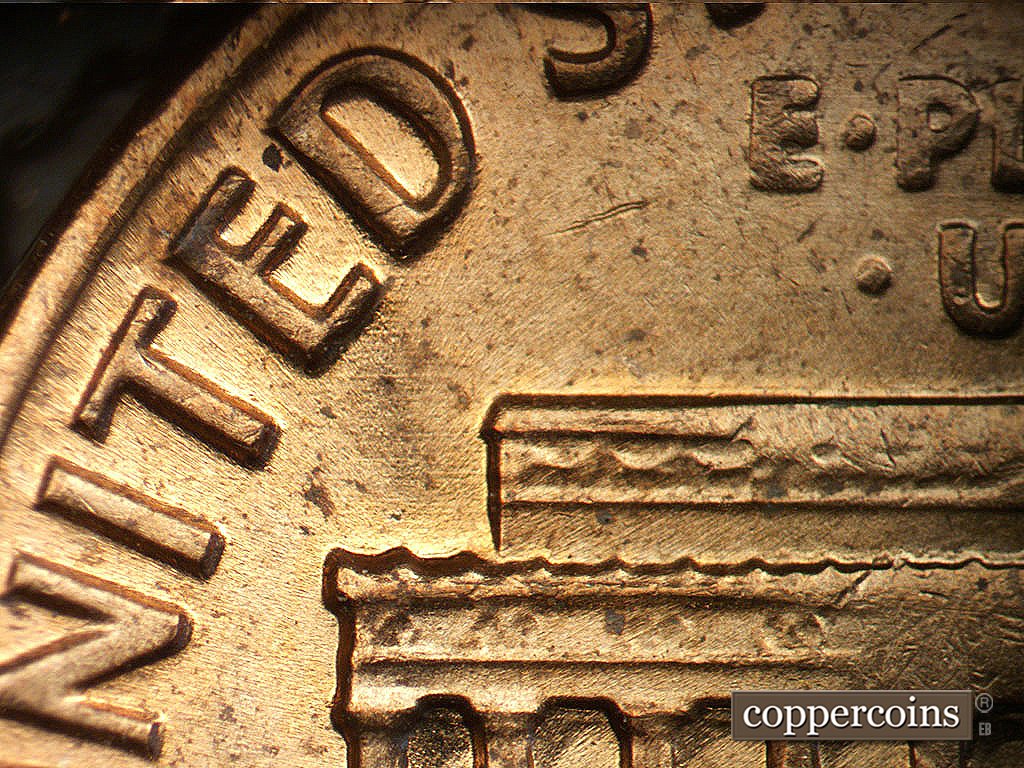 Die-stage B marker on 1971D•1MM•020 showing E/W die scratches.