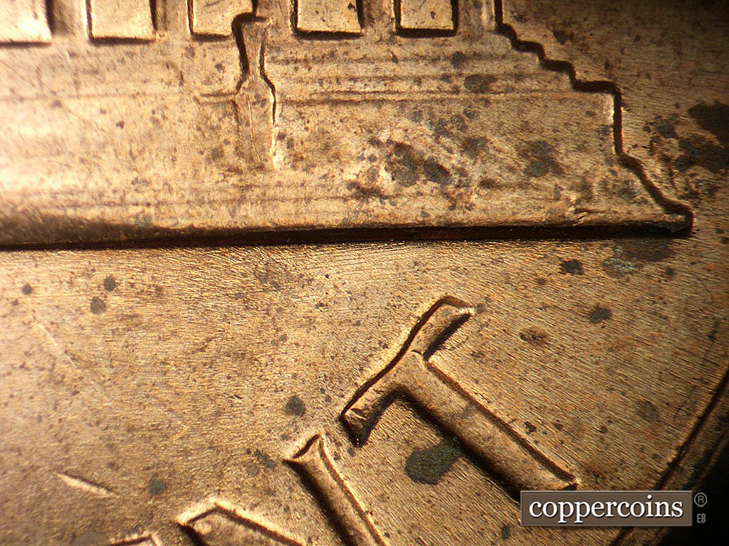 Die-stage B marker on 1971D•1MM•020 showing E/W die scratches.