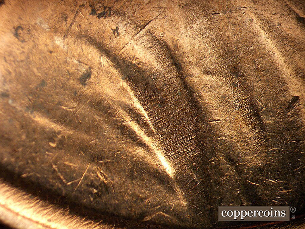 Die-stage B marker on 1971D•1MM•021 showing Die scratches in folds.