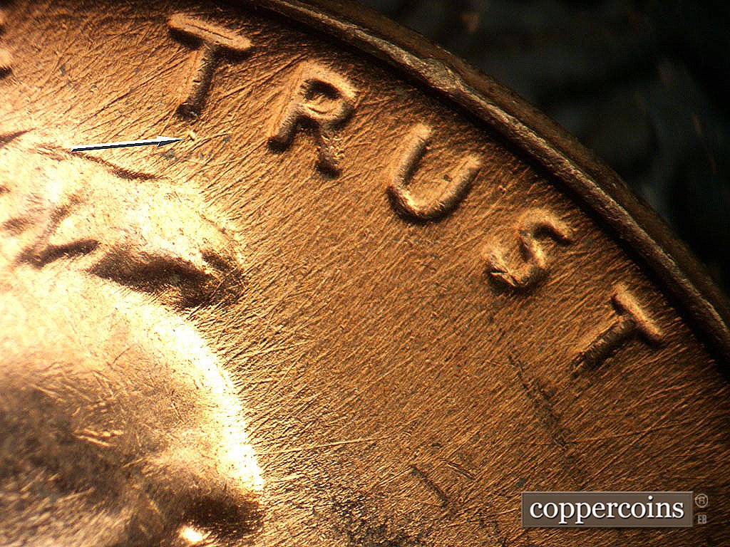 Die-stage B marker on 1971D•1MM•021 showing Die scratches through TRUST, Die gouge near first T in TRUST.