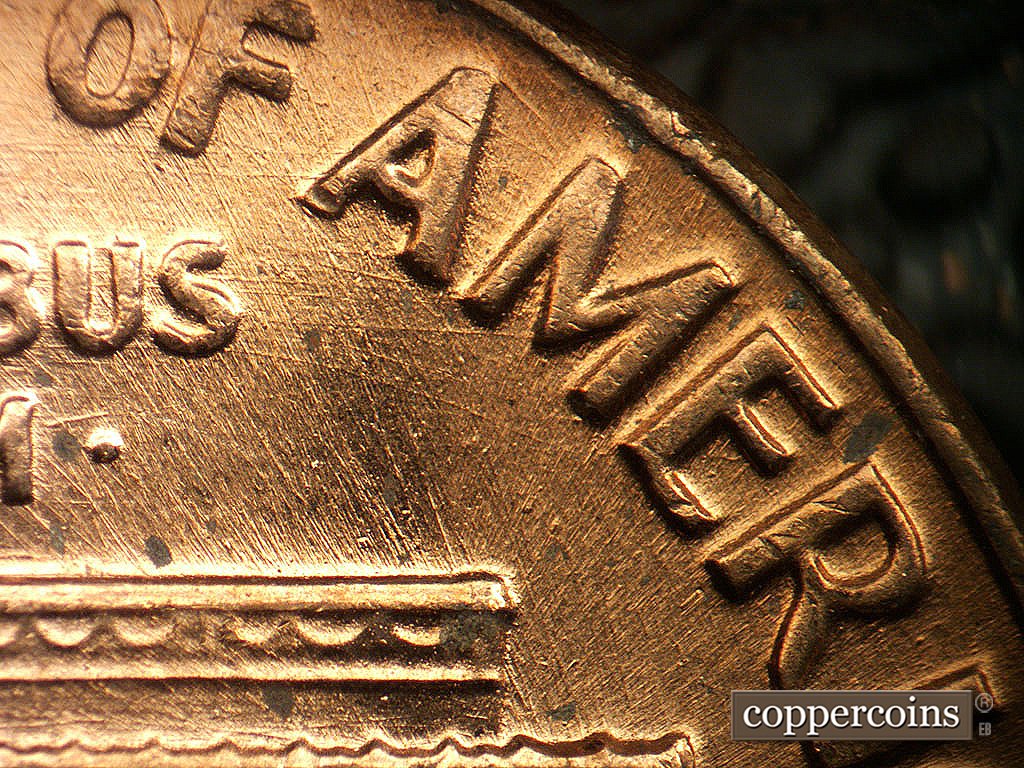 Die-stage B marker on 1971D•1MM•021 showing Die scratches through AMERICA.