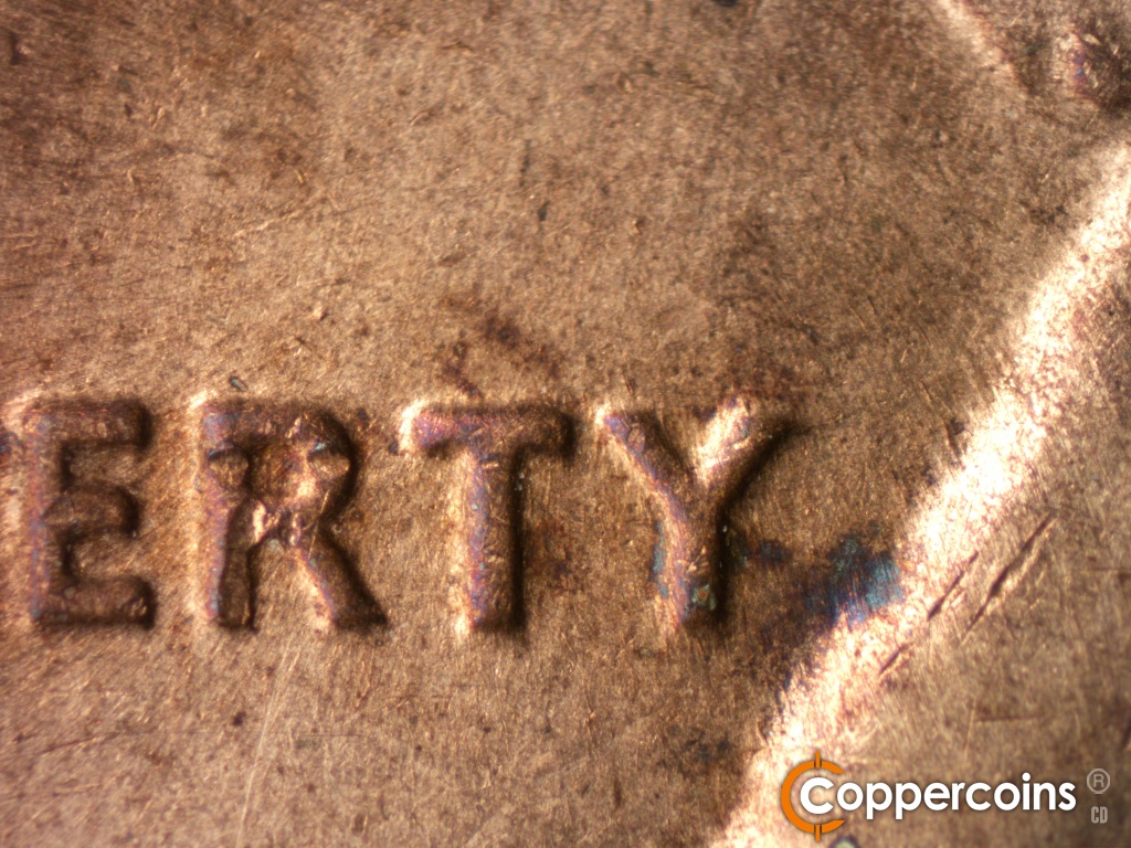 Die-stage C marker on 1974S•1MM•002 showing Light SSW die scratches through LIBERTY.