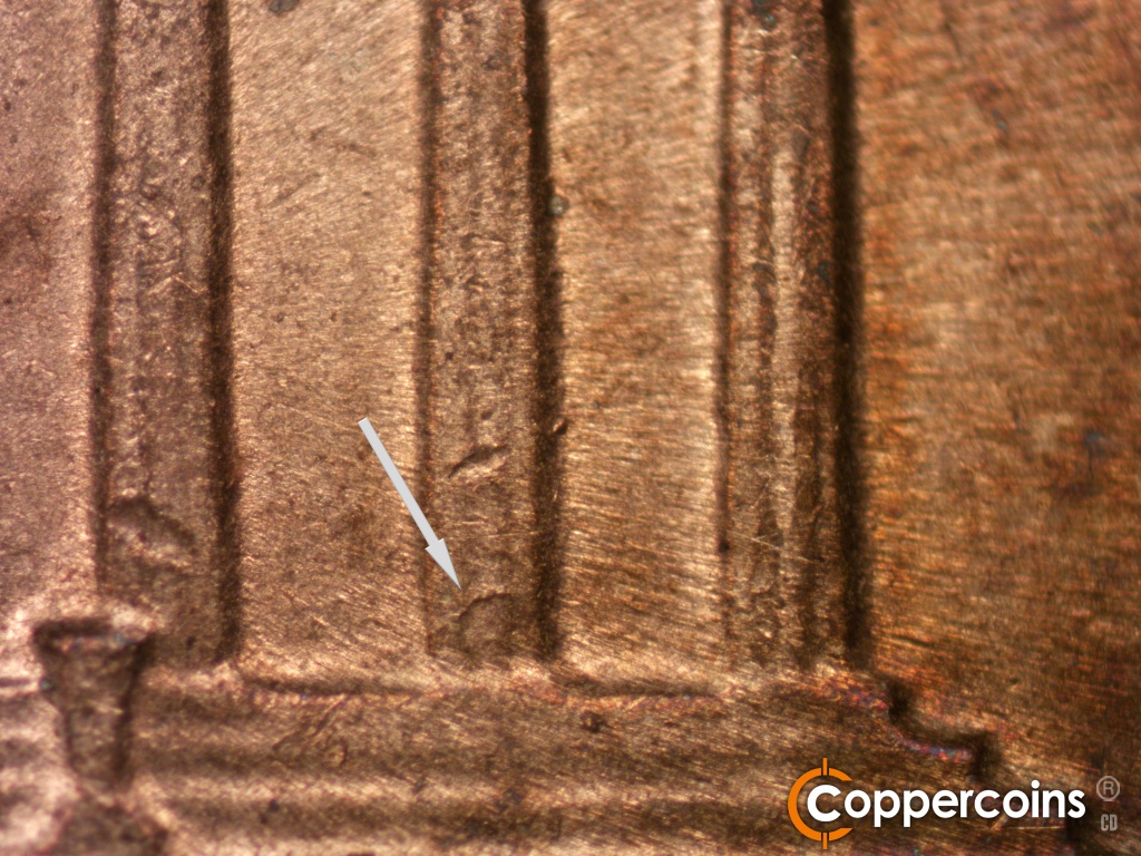 Die-stage C marker on 1974S•1MM•002 showing Die crack on lower column 11.