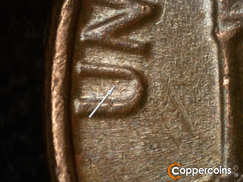 Die-stage B marker on 1981D•1MM•002 showing Die dot in U of UNITED.