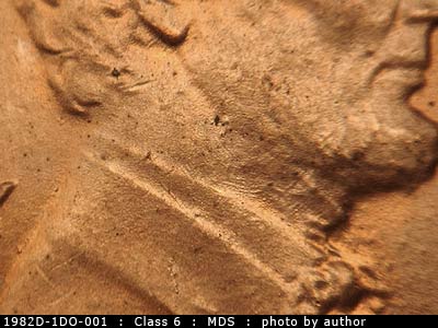 Die-stage B marker on 1982D•1DO•001 (1982 Doubled Die Obverse).