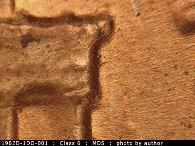 Die-stage B marker on 1982D•1DO•001 (1982 Doubled Die Obverse).