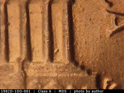 Die-stage B marker on 1982D•1DO•001 (1982 Doubled Die Obverse).