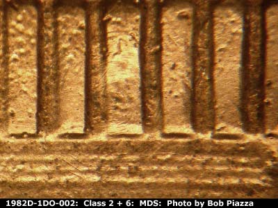 Die-stage B marker on 1982D•1DO•002 (1982 Doubled Die Obverse).