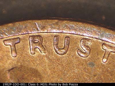 Die-stage B marker on 1982P•1DO•001 (1982 Doubled Die Obverse).