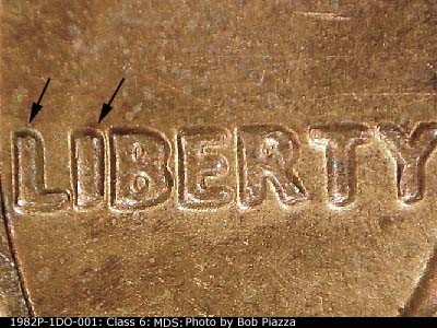 Die-stage B marker on 1982P•1DO•001 (1982 Doubled Die Obverse).