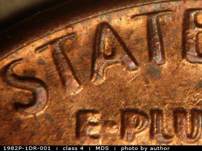 Die-stage B marker on 1982P•1DR•001 (1982 Doubled Die Reverse).