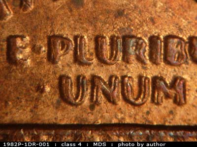 Die-stage B marker on 1982P•1DR•001 (1982 Doubled Die Reverse).