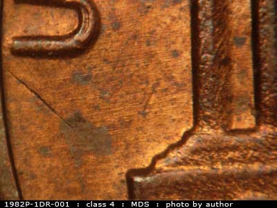 Die-stage B marker on 1982P•1DR•001 (1982 Doubled Die Reverse).