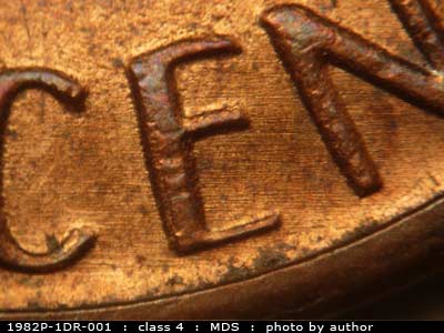 Die-stage B marker on 1982P•1DR•001 (1982 Doubled Die Reverse).