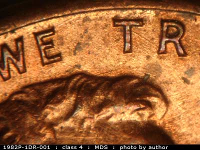 Die-stage B marker on 1982P•1DR•001 (1982 Doubled Die Reverse).