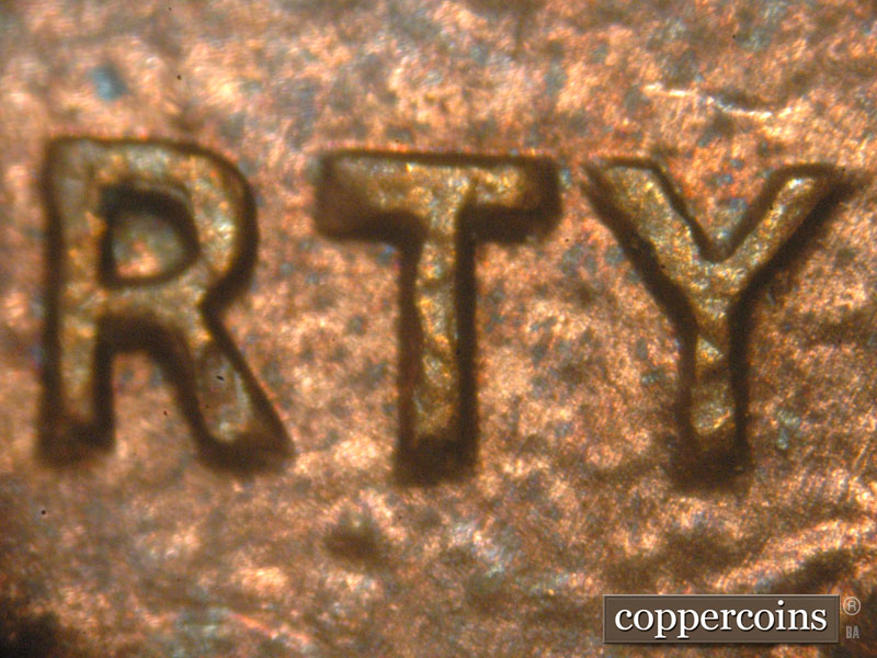 Die-stage B marker on 1983P•1DO•001 (1983 Doubled Die Obverse).