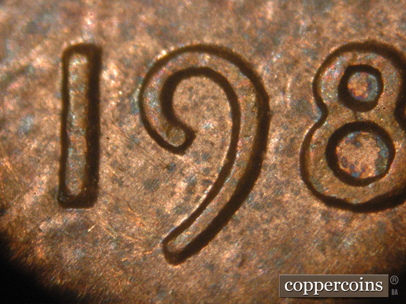 Die-stage B marker on 1983P•1DO•001 (1983 Doubled Die Obverse).