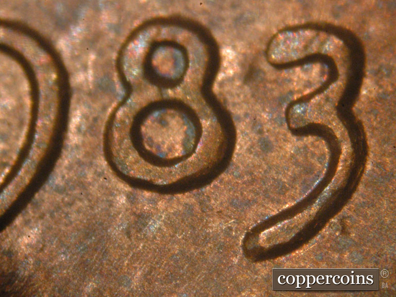 Die-stage B marker on 1983P•1DO•001 (1983 Doubled Die Obverse).
