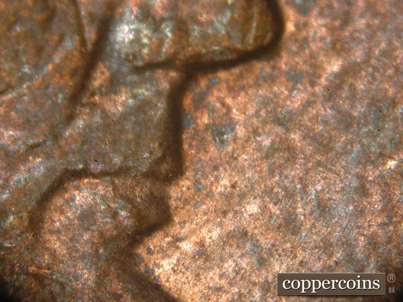 Die-stage B marker on 1983P•1DO•001 (1983 Doubled Die Obverse).