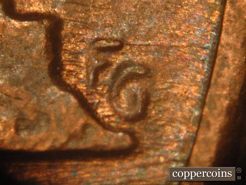 Die-stage B marker on 1983P•1DO•001 (1983 Doubled Die Obverse).