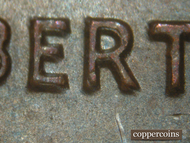 Die-stage A marker on 1983P•1DO•001 (1983 Doubled Die Obverse).