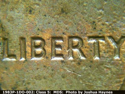 Die-stage B marker on 1983P•1DO•002 (1983 Doubled Die Obverse).