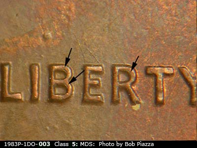 Die-stage B marker on 1983P•1DO•003 (1983 Doubled Die Obverse).