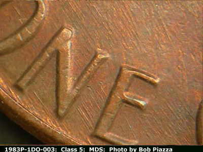 Die-stage B marker on 1983P•1DO•003 (1983 Doubled Die Obverse).
