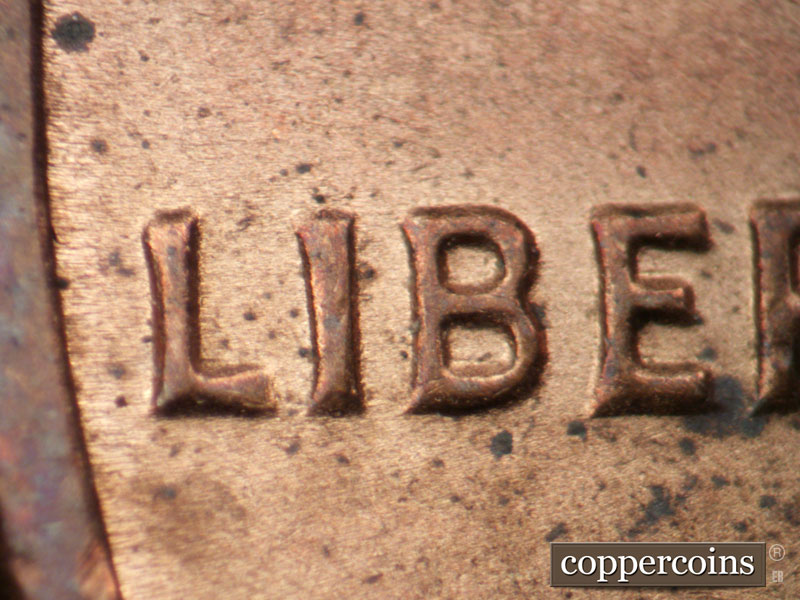 Die-stage B marker on 1983P•1DO•004 (1983 Doubled Die Obverse).