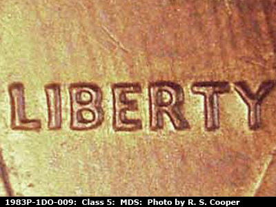 Die-stage B marker on 1983P•1DO•009 (1983 Doubled Die Obverse).