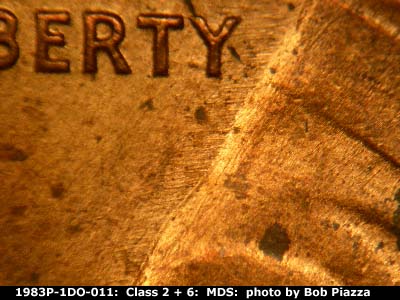 Die-stage B marker on 1983P•1DO•011 (1983 Doubled Die Obverse).