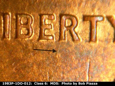 Die-stage B marker on 1983P•1DO•012 (1983 Doubled Die Obverse).