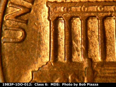 Die-stage B marker on 1983P•1DO•012 (1983 Doubled Die Obverse).
