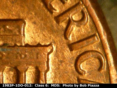 Die-stage B marker on 1983P•1DO•012 (1983 Doubled Die Obverse).