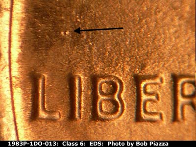Die-stage A marker on 1983P•1DO•013 (1983 Doubled Die Obverse).