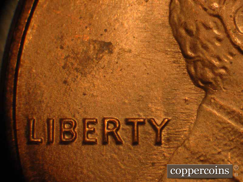 Die-stage B marker on 1983P•1DO•017 (1983 Doubled Die Obverse).