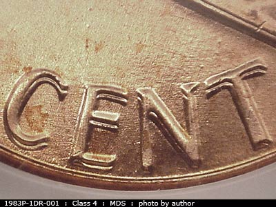Die-stage B marker on 1983P•1DR•001 (1983 Doubled Die Reverse).