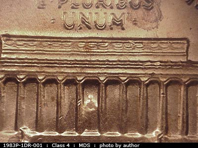 Die-stage B marker on 1983P•1DR•001 (1983 Doubled Die Reverse).