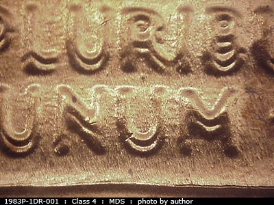 Die-stage B marker on 1983P•1DR•001 (1983 Doubled Die Reverse).