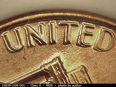 Die-stage B marker on 1983P•1DR•001 (1983 Doubled Die Reverse).