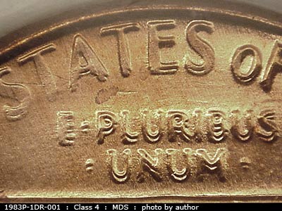 Die-stage B marker on 1983P•1DR•001 (1983 Doubled Die Reverse).